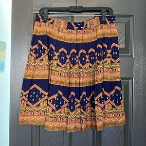 High waisted, pleaded skirt.